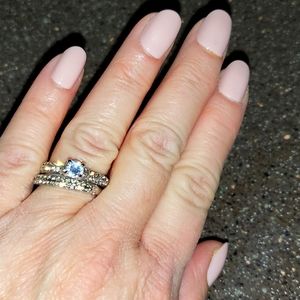 Silver band and solitaire set, round rhinestones, size 7.
